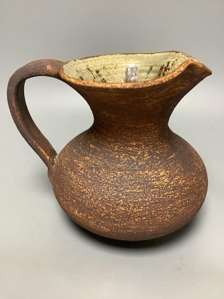 Waistel Cooper (1921-2003). A pottery jug with textured glazed body, height 18cm